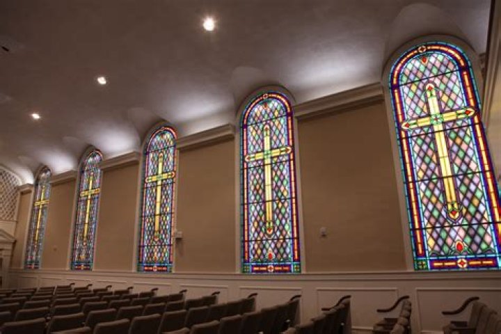 Why do churches have colored windows?